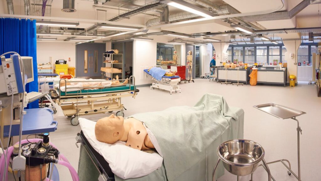 St James campus showing surgical room with mannequin in ward bed.