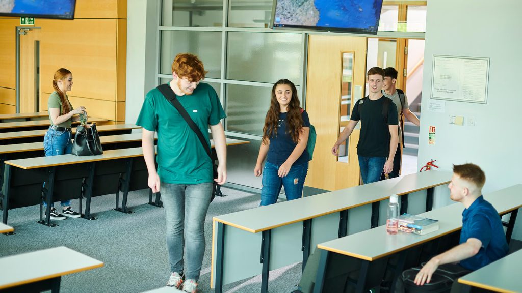 Students enter a lecture theatre in the Geosciences building.