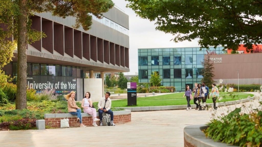 An image of two groups of students outside of the Universities Catalyst building.