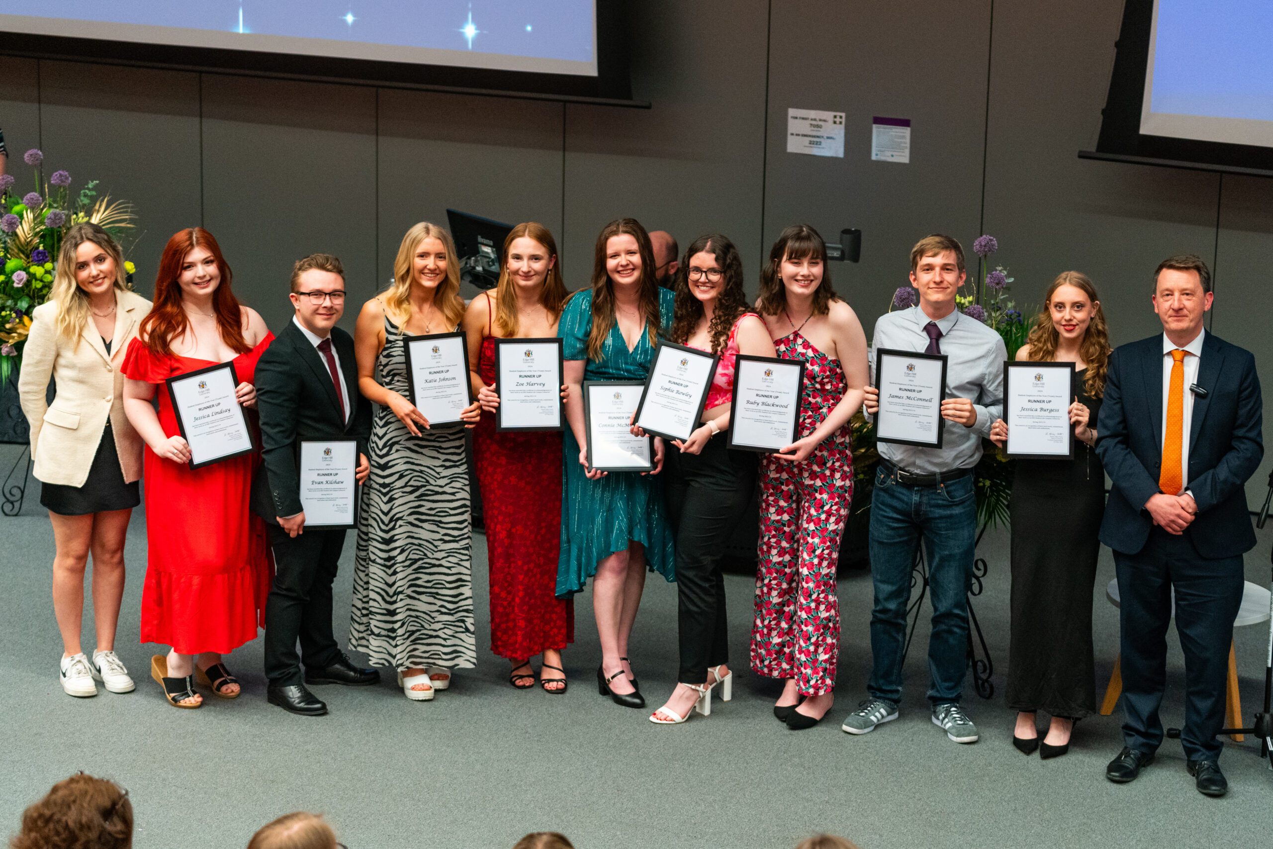 EHU Student Campus Connectors with their framed certificates at the Careers Awards, photographed with with Pro Vice-Chancellor, Liam Owens.