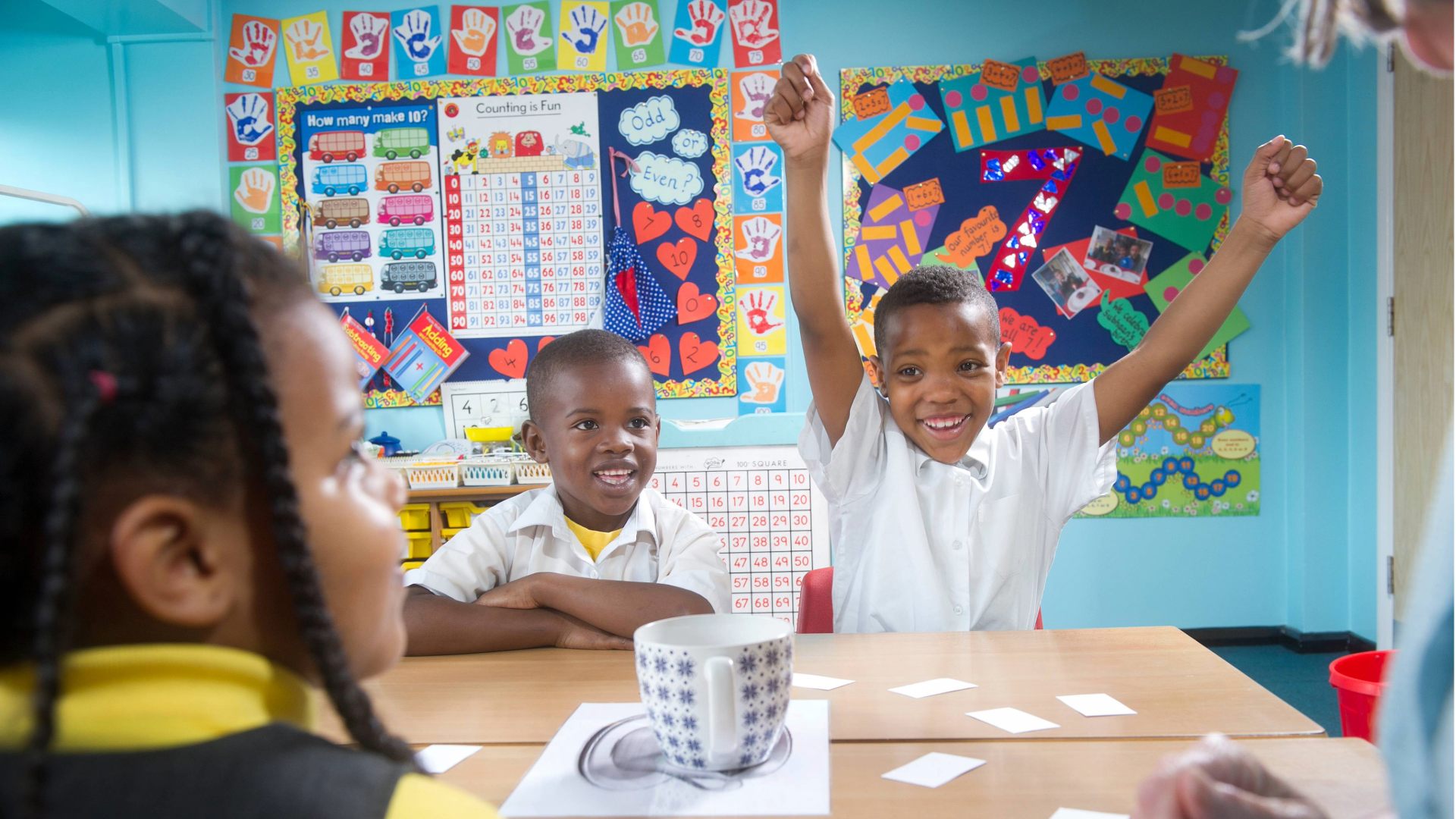 Children working on a mathematics intervention activity in the classroom.