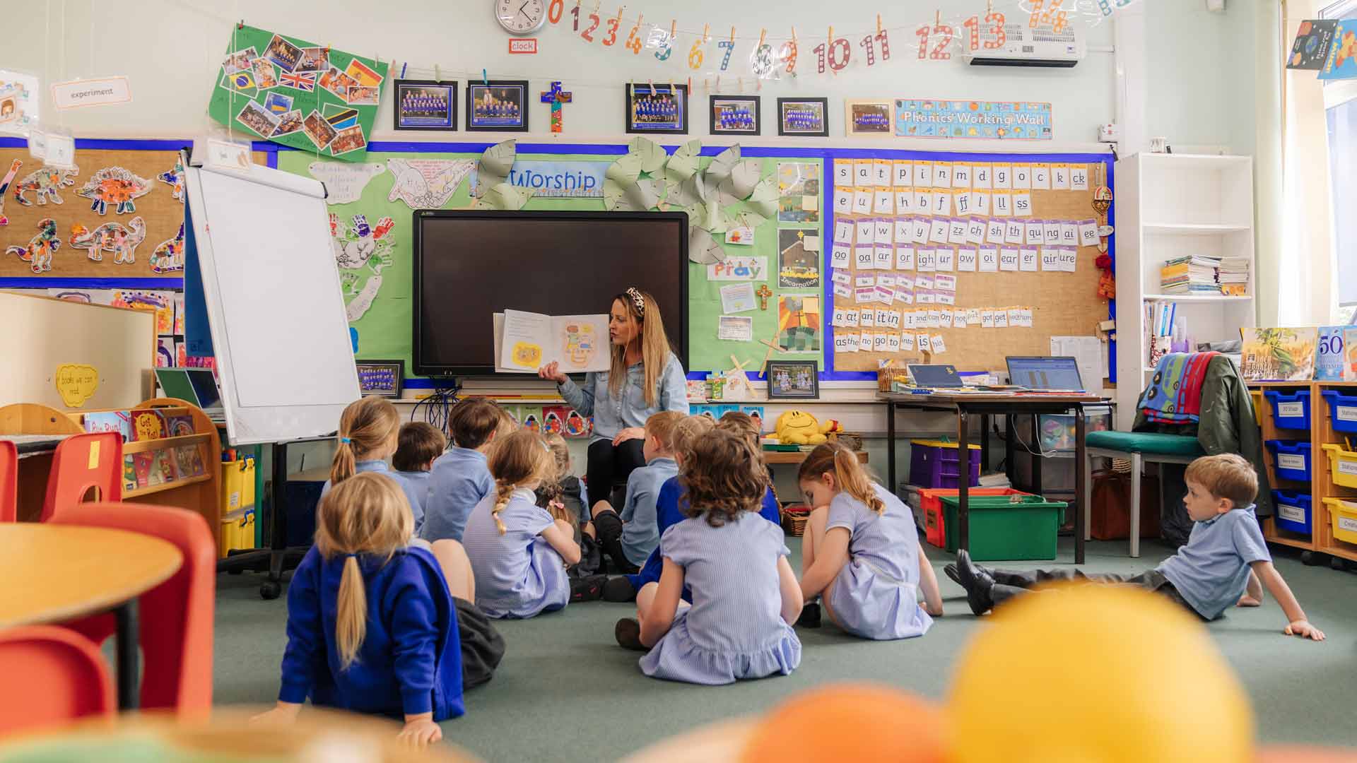 Young children in a classroom being taught