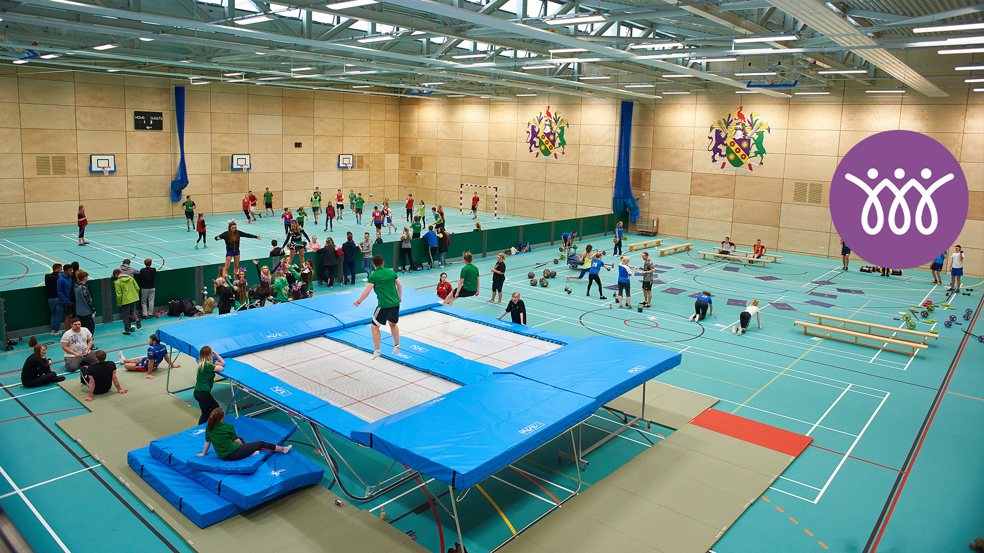 group of students using the sports hall in the sports centre