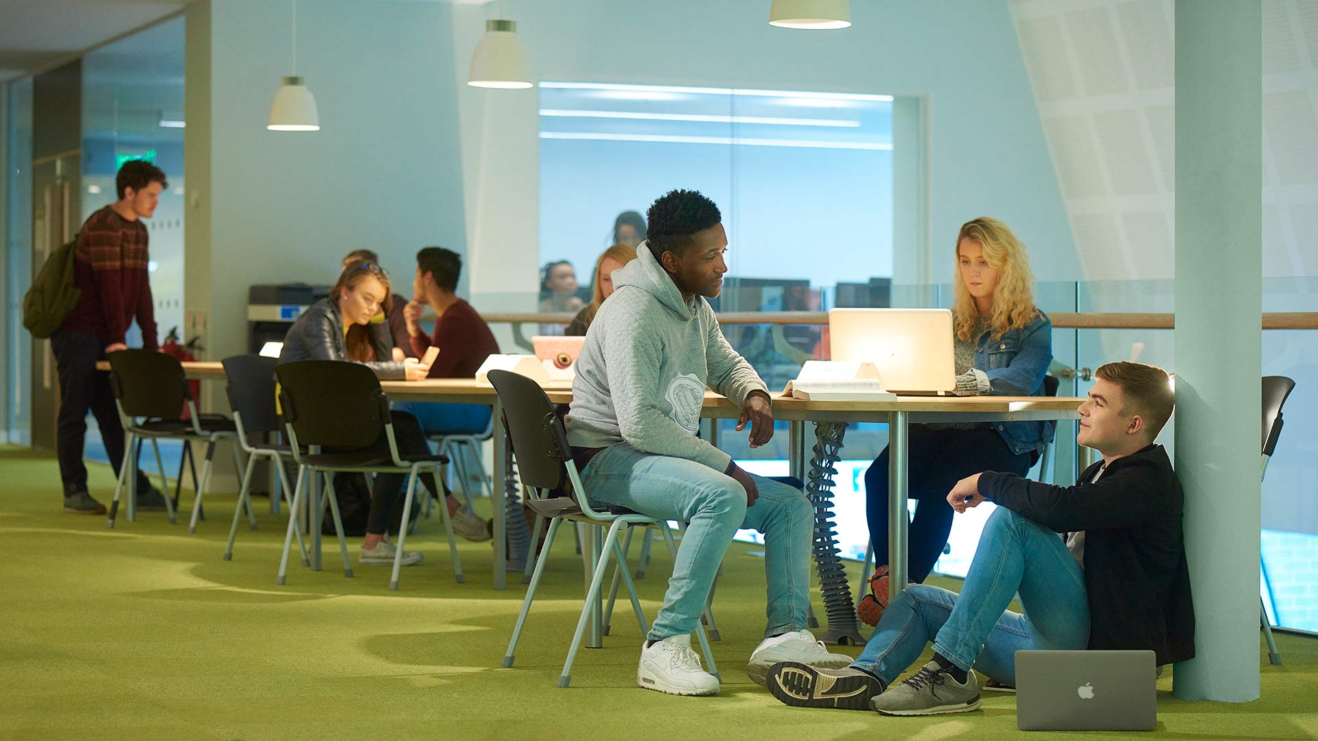 Students chatting and studying on campus