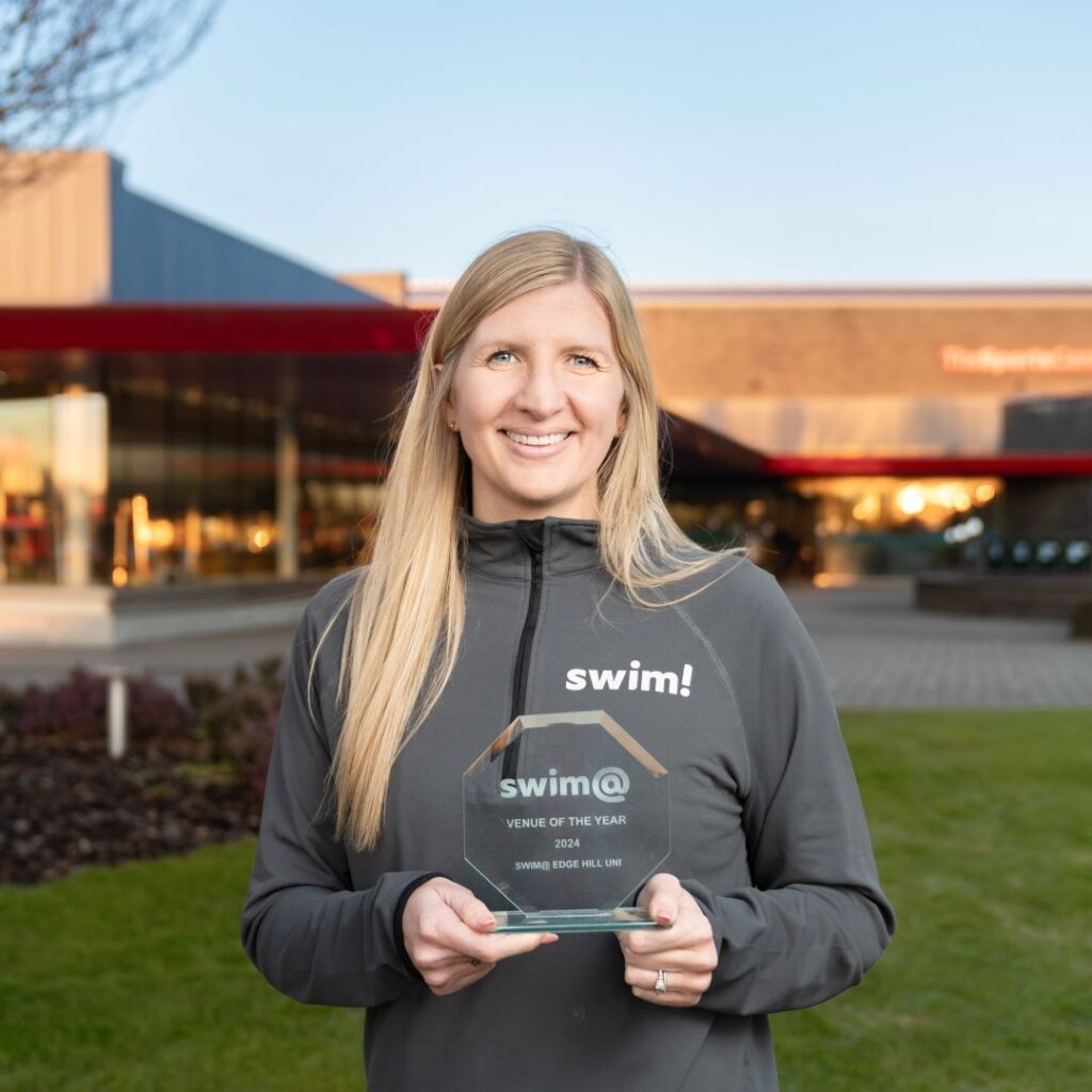 Rebecca Adlington holds a swim! 'venue of the year' trophy.