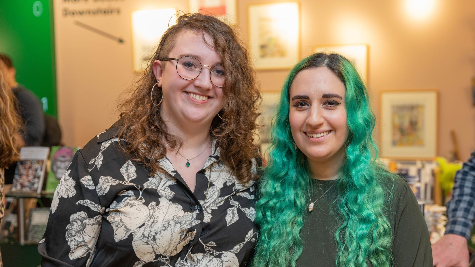 Student Alma Lilja stands side by side with judge Harriet Hirshman and smile at the camera.